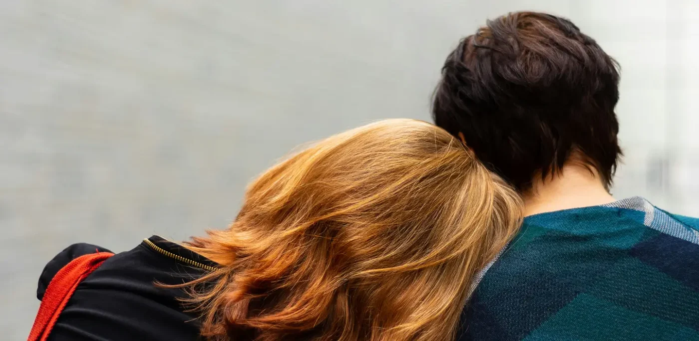 Two people resting close together showing support and companionship